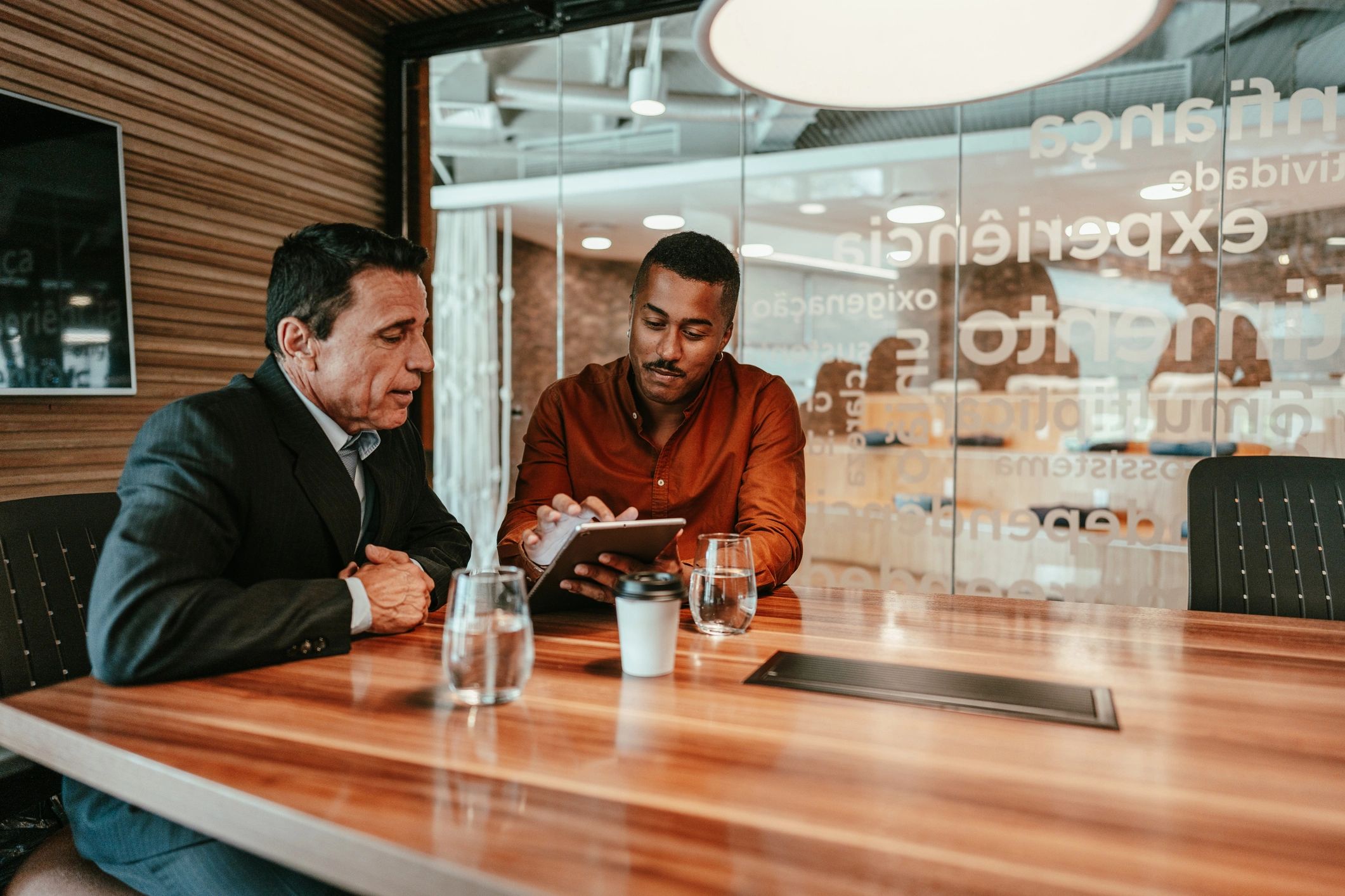 Business professional presenting ideas on a tablet