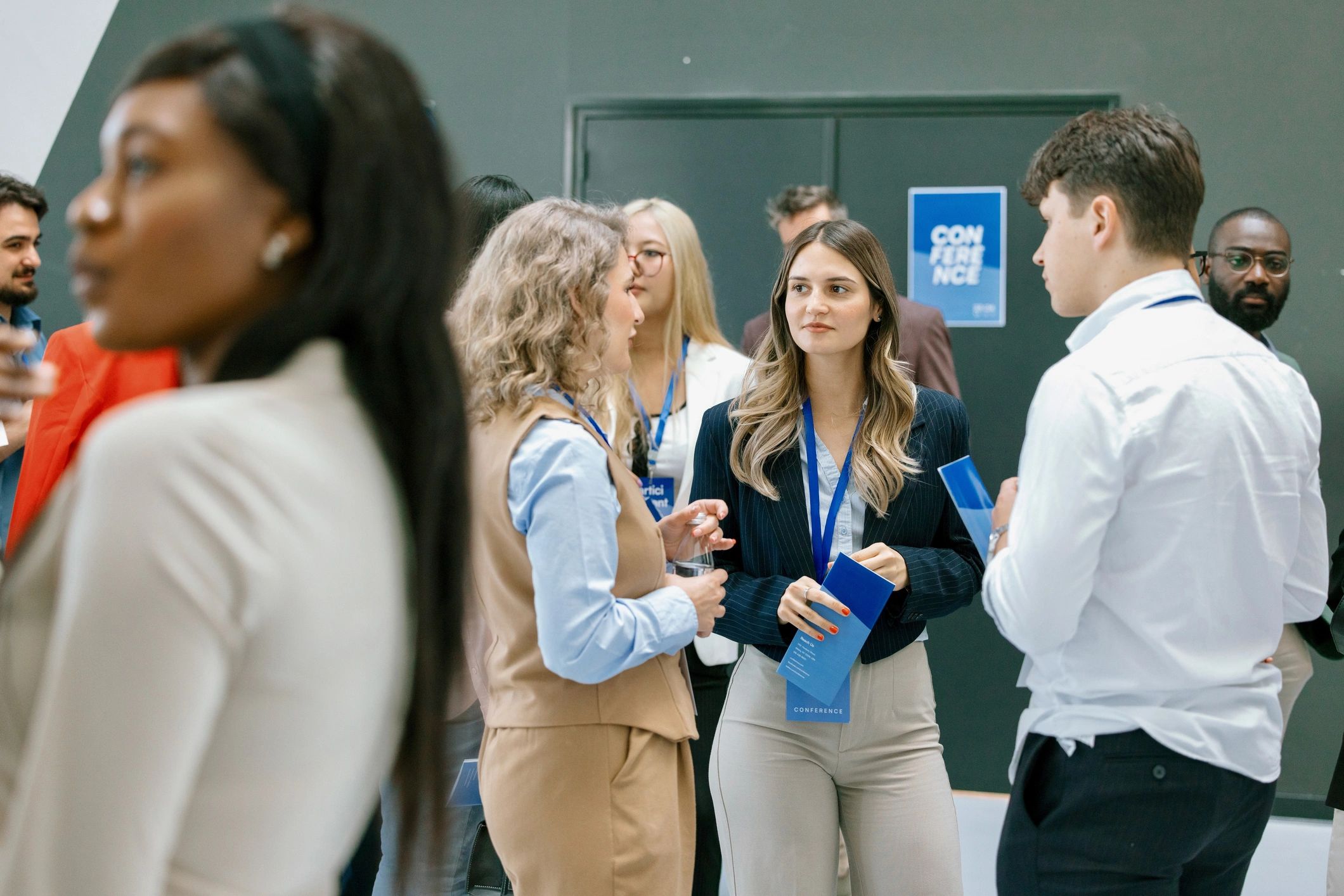 Diverse business professionals networking during a conference break